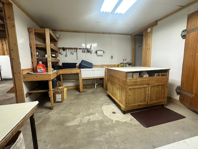 bathroom with a workshop area and concrete floors