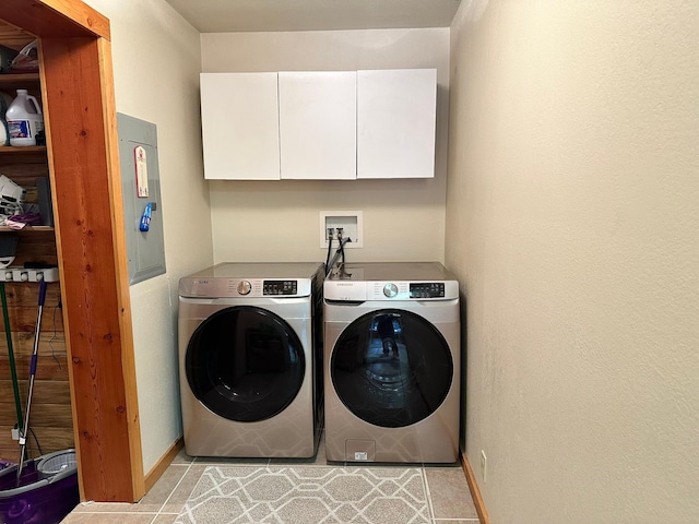 27 Birch Ln, Trout Creek, MT 59874 - laundry area with cabinet space, washer and clothes dryer, electric panel, and baseboards