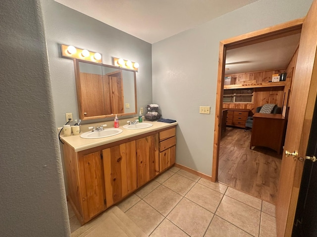 27 Birch Ln, Trout Creek, MT 59874 - bathroom featuring double vanity, tile patterned floors, a textured wall, and a sink