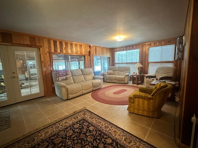 tiled living room featuring wooden walls