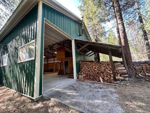 27 Birch Ln, Trout Creek, MT 59874 - view of property exterior with an outdoor structure and board and batten siding