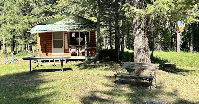 27 Birch Ln, Trout Creek, MT 59874 - view of green lawn with an outbuilding and a wooded view