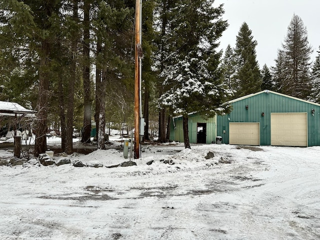 view of snow covered garage