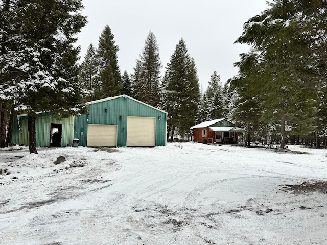 view of snow covered garage