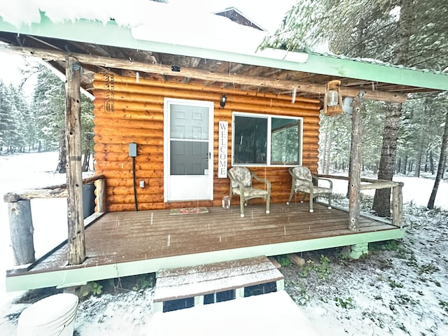 view of snow covered deck