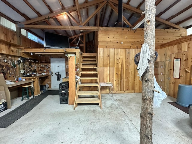 27 Birch Ln, Trout Creek, MT 59874 - basement with wood walls, stairway, and a workshop area