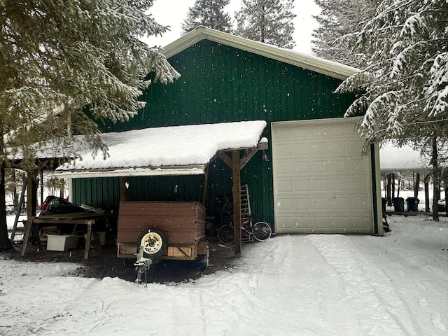 view of snow covered garage