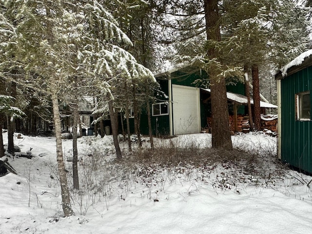 view of yard covered in snow