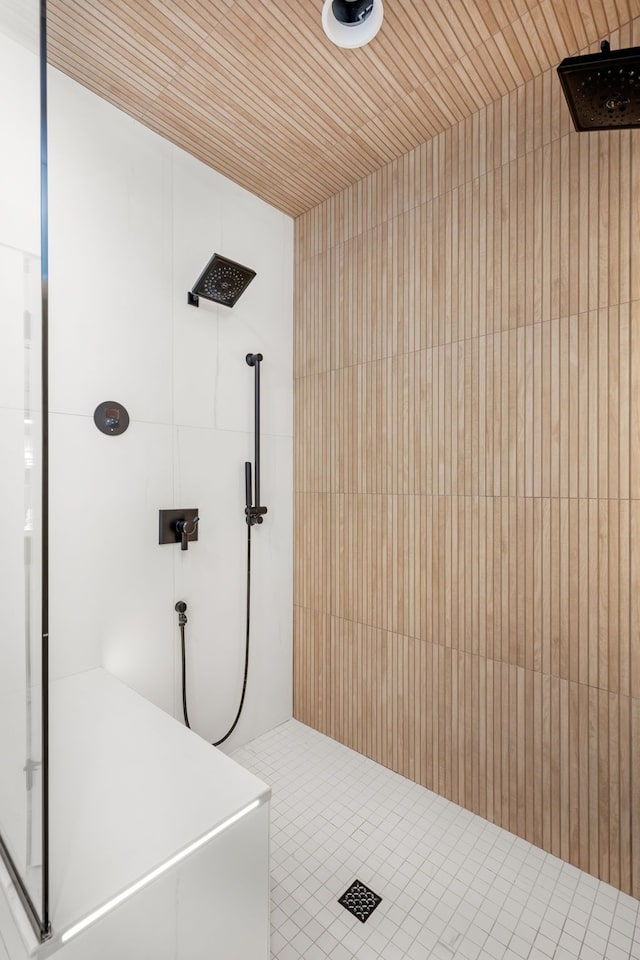 bathroom with wooden ceiling and tiled shower