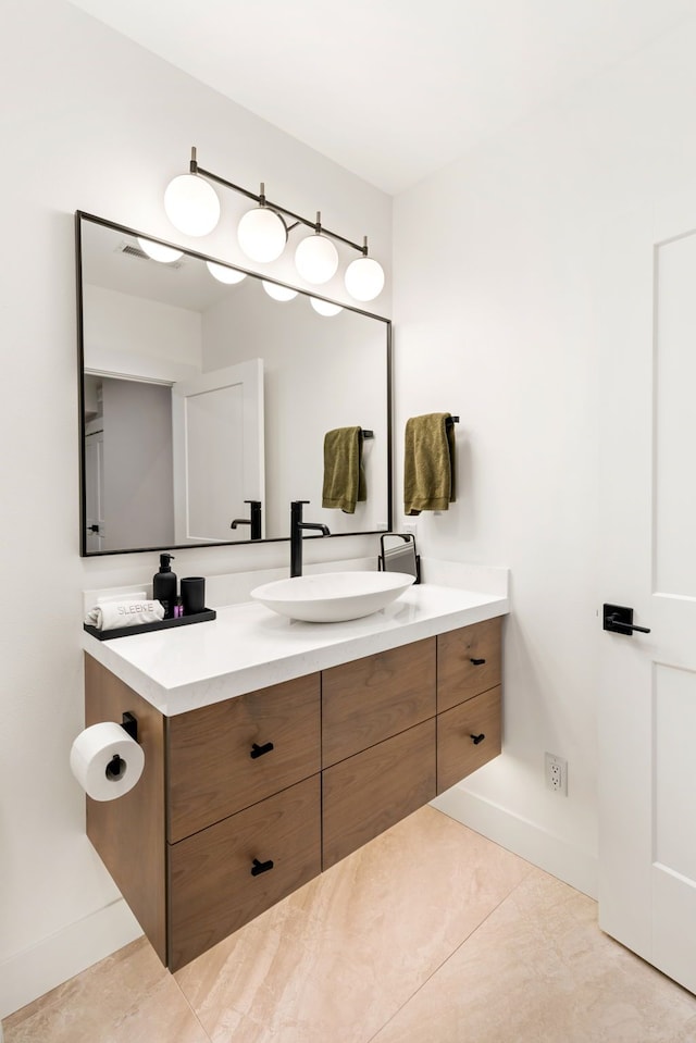 bathroom with vanity and tile patterned floors