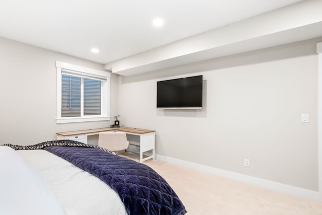 bedroom featuring light colored carpet