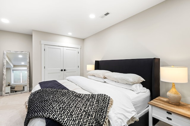 bedroom with carpet flooring and a closet