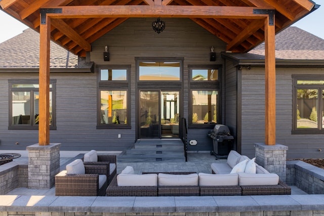 exterior space with grilling area and an outdoor living space