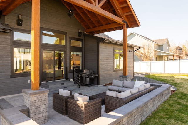 view of patio with grilling area and an outdoor living space