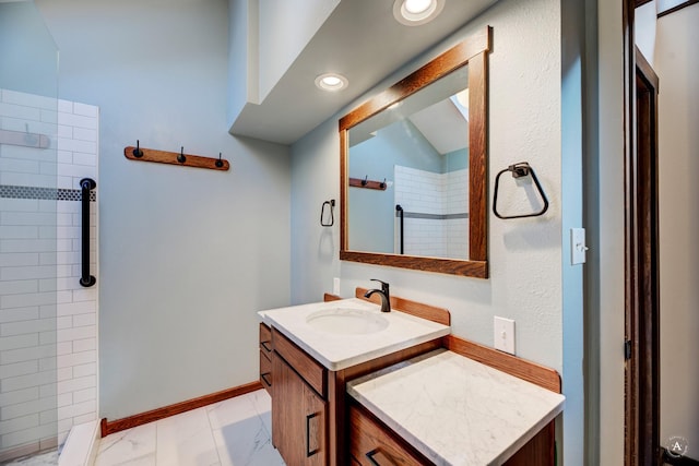 bathroom featuring vanity and a tile shower