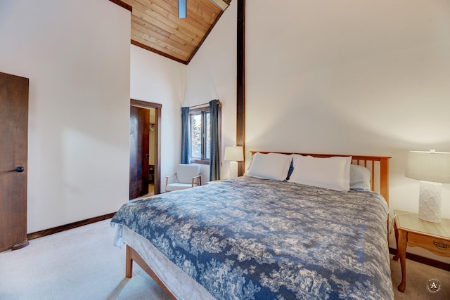 carpeted bedroom featuring high vaulted ceiling and wooden ceiling