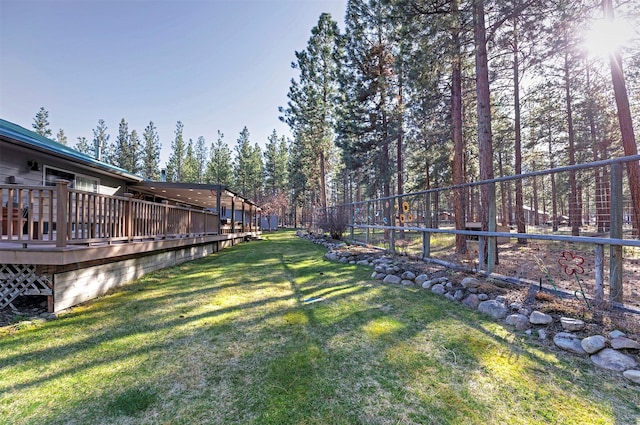 view of yard featuring a wooden deck