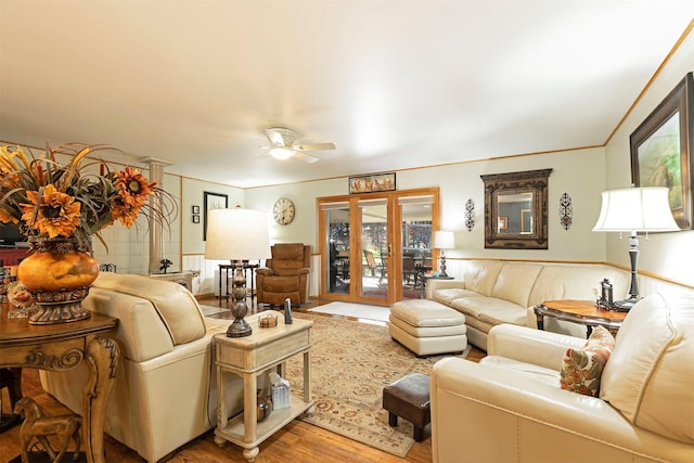 living room with ceiling fan and hardwood / wood-style floors