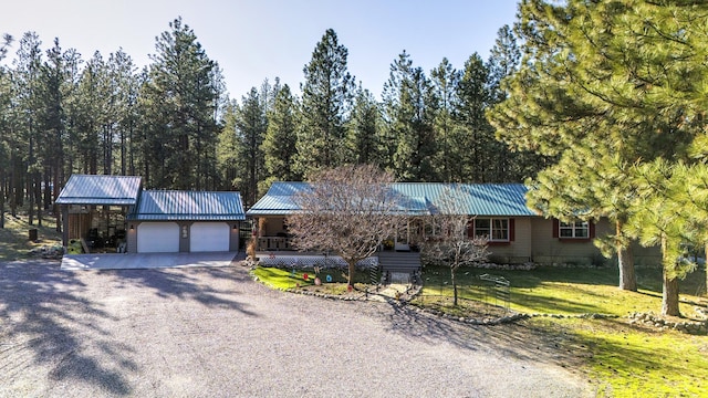 single story home featuring a garage and a front lawn