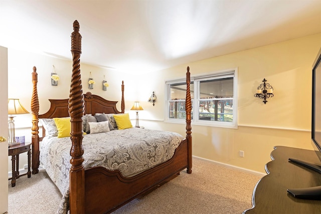 bedroom featuring light colored carpet