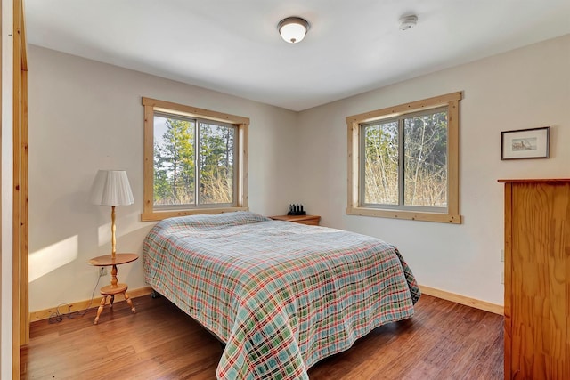 bedroom with hardwood / wood-style floors