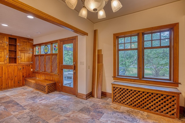 mudroom featuring plenty of natural light, ornamental molding, and ceiling fan