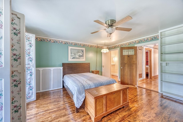 bedroom featuring ceiling fan and wood-type flooring