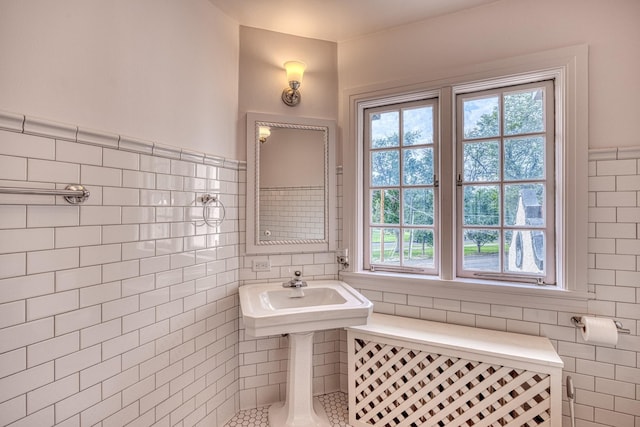 bathroom with tile walls