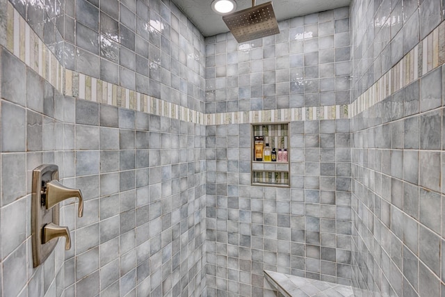 bathroom with a tile shower
