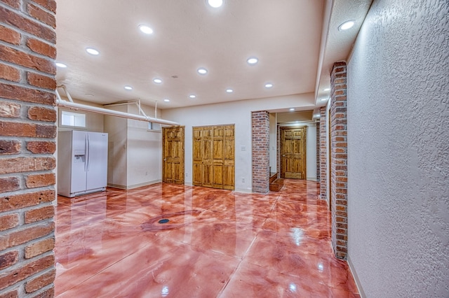 hall with concrete floors