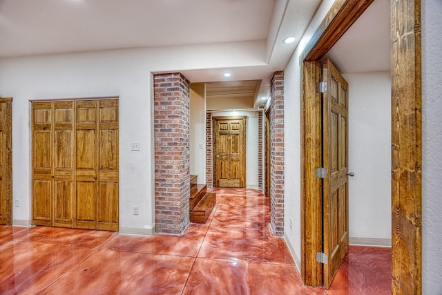 hallway featuring concrete floors