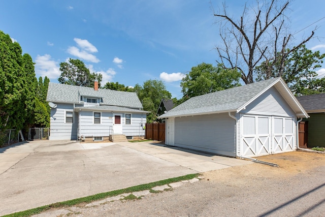 view of front facade with a garage and an outdoor structure