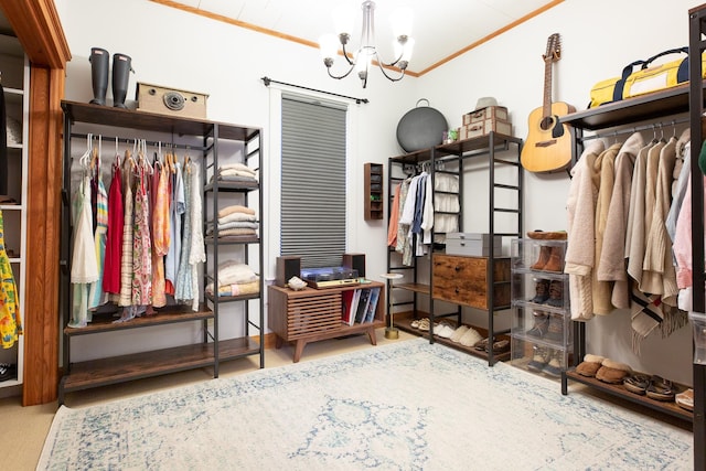 spacious closet featuring a notable chandelier