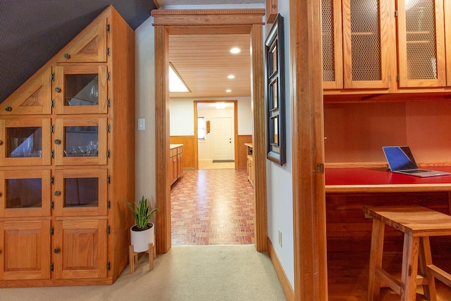 hallway featuring light colored carpet