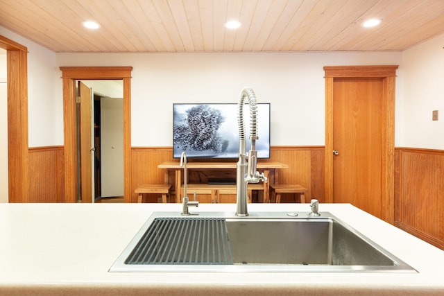 kitchen featuring sink and wooden ceiling