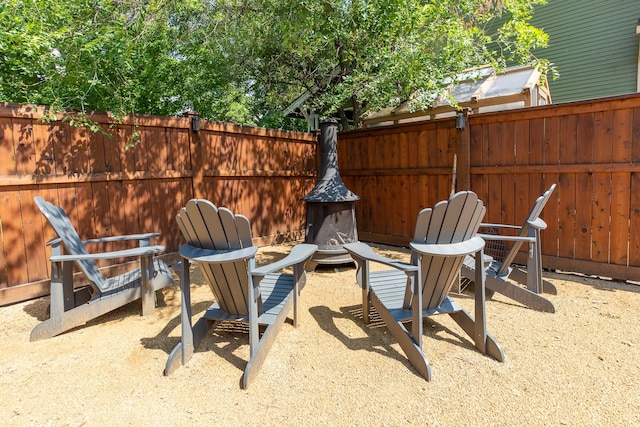 view of patio / terrace with an outdoor fire pit