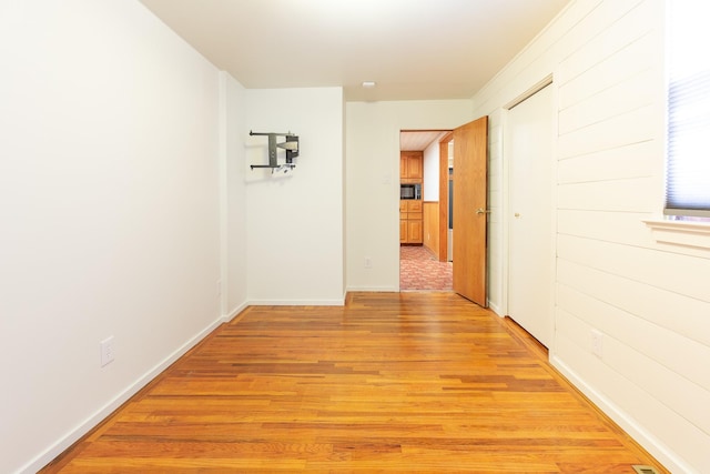 corridor featuring light hardwood / wood-style floors