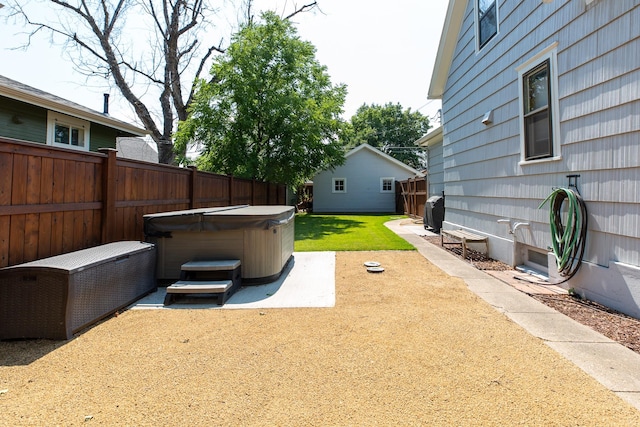 view of yard featuring a patio area and a hot tub