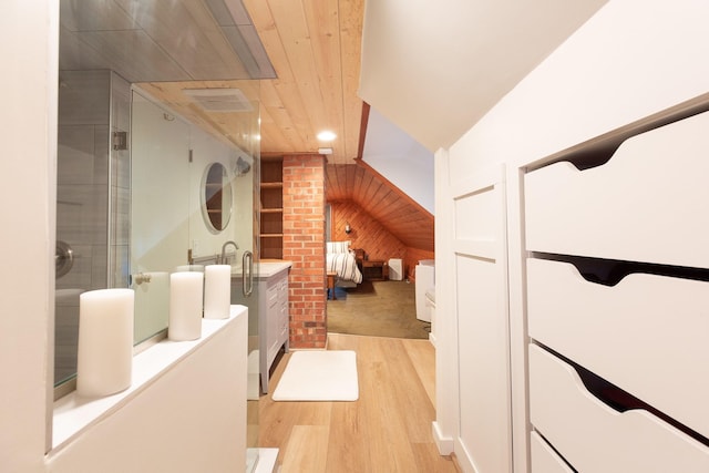 interior space featuring hardwood / wood-style flooring, wooden ceiling, a shower with door, and wooden walls