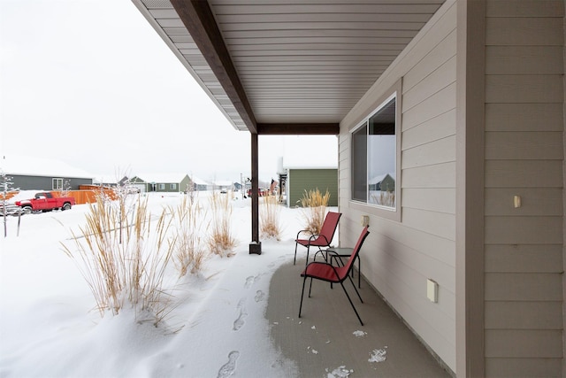 view of snow covered patio