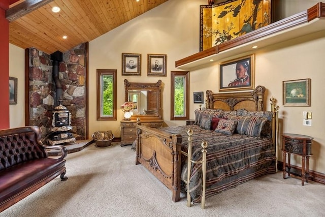 carpeted bedroom featuring wooden ceiling, high vaulted ceiling, and a wood stove