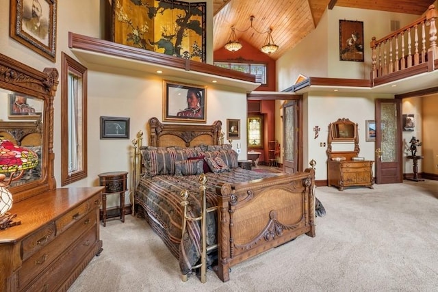 carpeted bedroom featuring wood ceiling and high vaulted ceiling