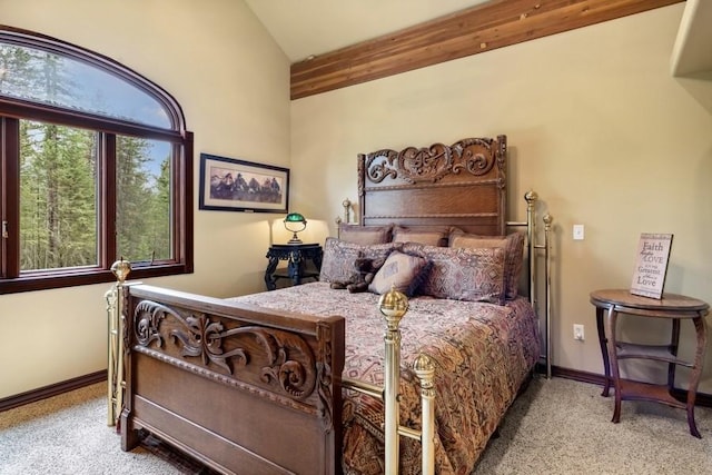 bedroom featuring light colored carpet and lofted ceiling