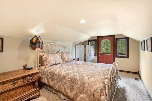 carpeted bedroom featuring vaulted ceiling