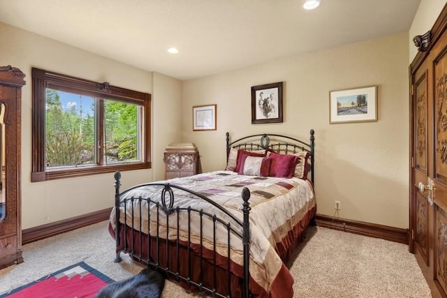 bedroom featuring light carpet