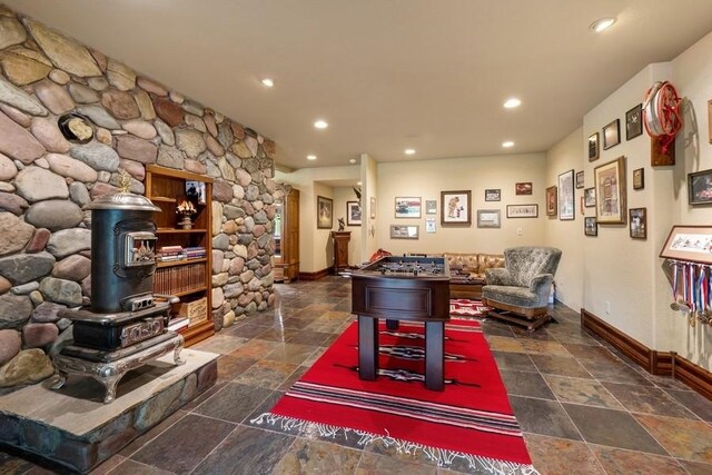 940 Mccaffery Rd, Bigfork, MT 59911 - playroom featuring stone tile flooring, recessed lighting, and decorative columns
