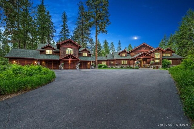 940 Mccaffery Rd, Bigfork, MT 59911 - view of front of home featuring driveway and a garage