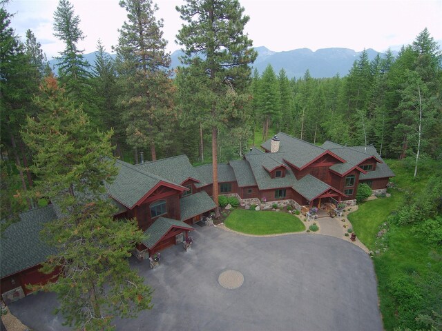 940 Mccaffery Rd, Bigfork, MT 59911 - view of subject property featuring a forest and mountains