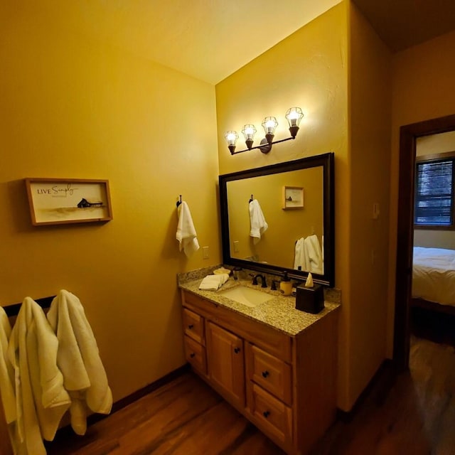 bathroom with vanity and hardwood / wood-style flooring