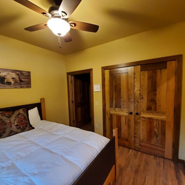 bedroom with ceiling fan and wood-type flooring